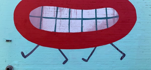 He smiles, but she doesn't see